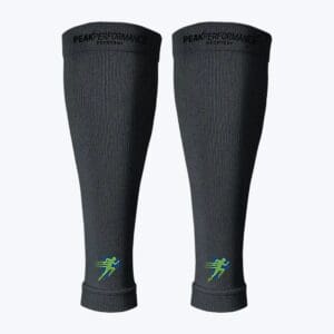 A pair of black leg warmers with green lightning bolts on them.