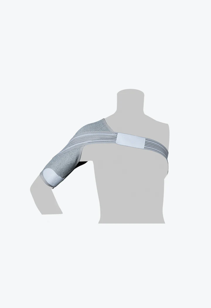 A person wearing a shoulder brace with their arm in the air.