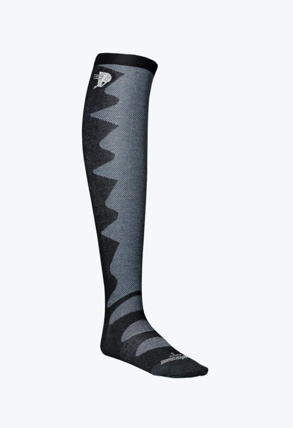 A pair of black and gray socks with an animal on them.