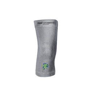 A gray knee brace with a green cross on it.