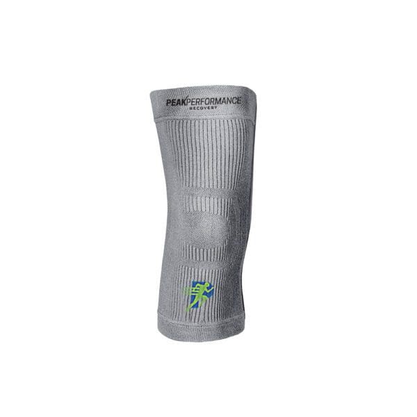 A gray knee brace with a green cross on it.