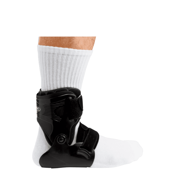 A person wearing an ankle brace on their foot.